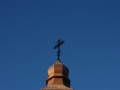 copper church tower with cross