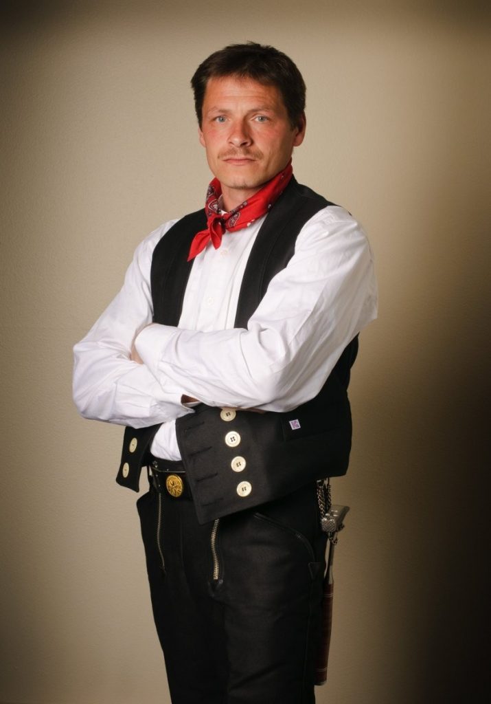 Erno Meister Kleidung, Co-owner of Spengler Industries posing in his traditional uniform
