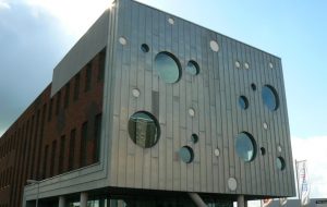 naturel zinc panels on the side of an office building