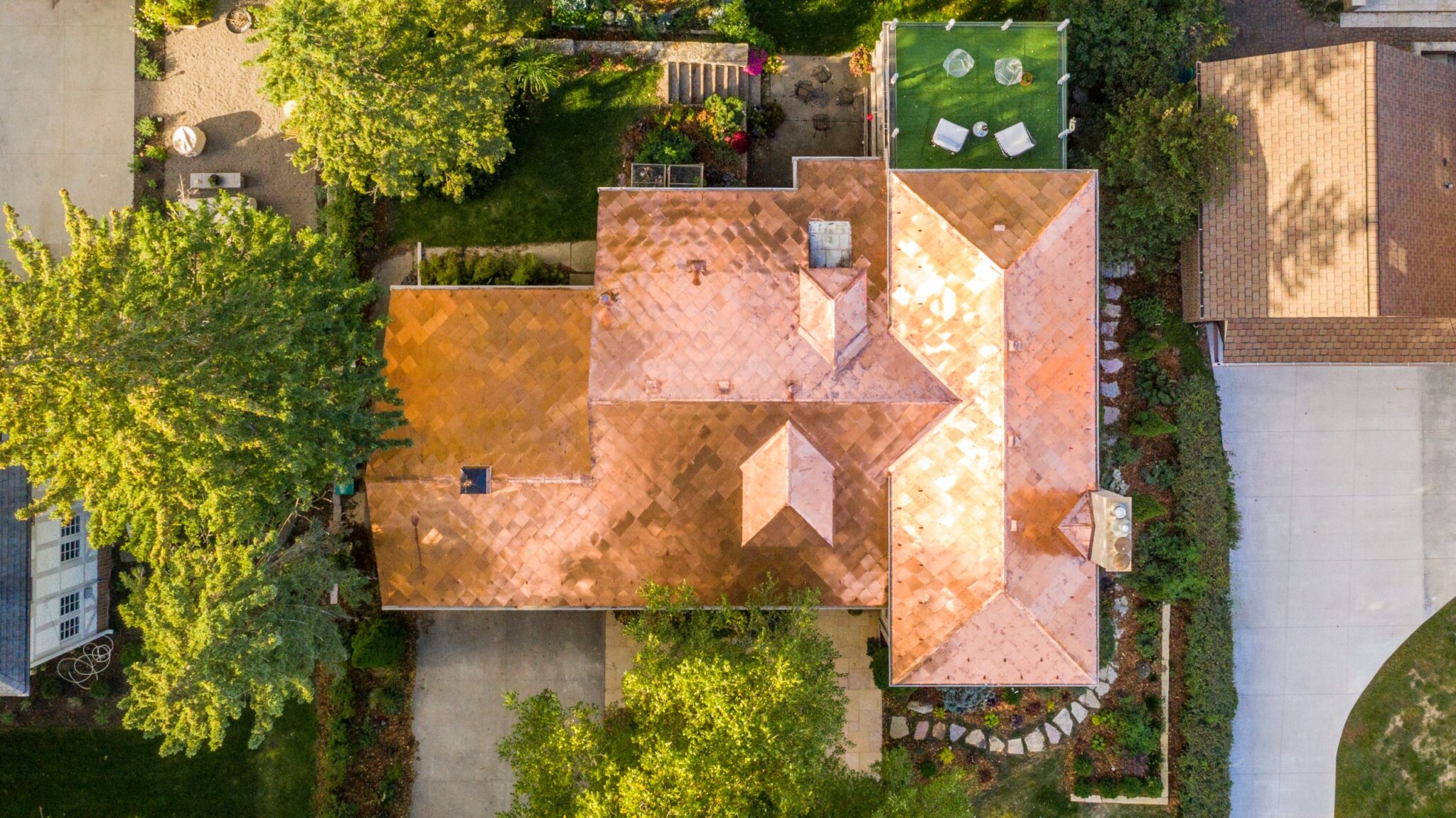 Top down view of shiny copper roof with diamond shingles