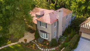 Copper diamond shingles with snow hooks on roof