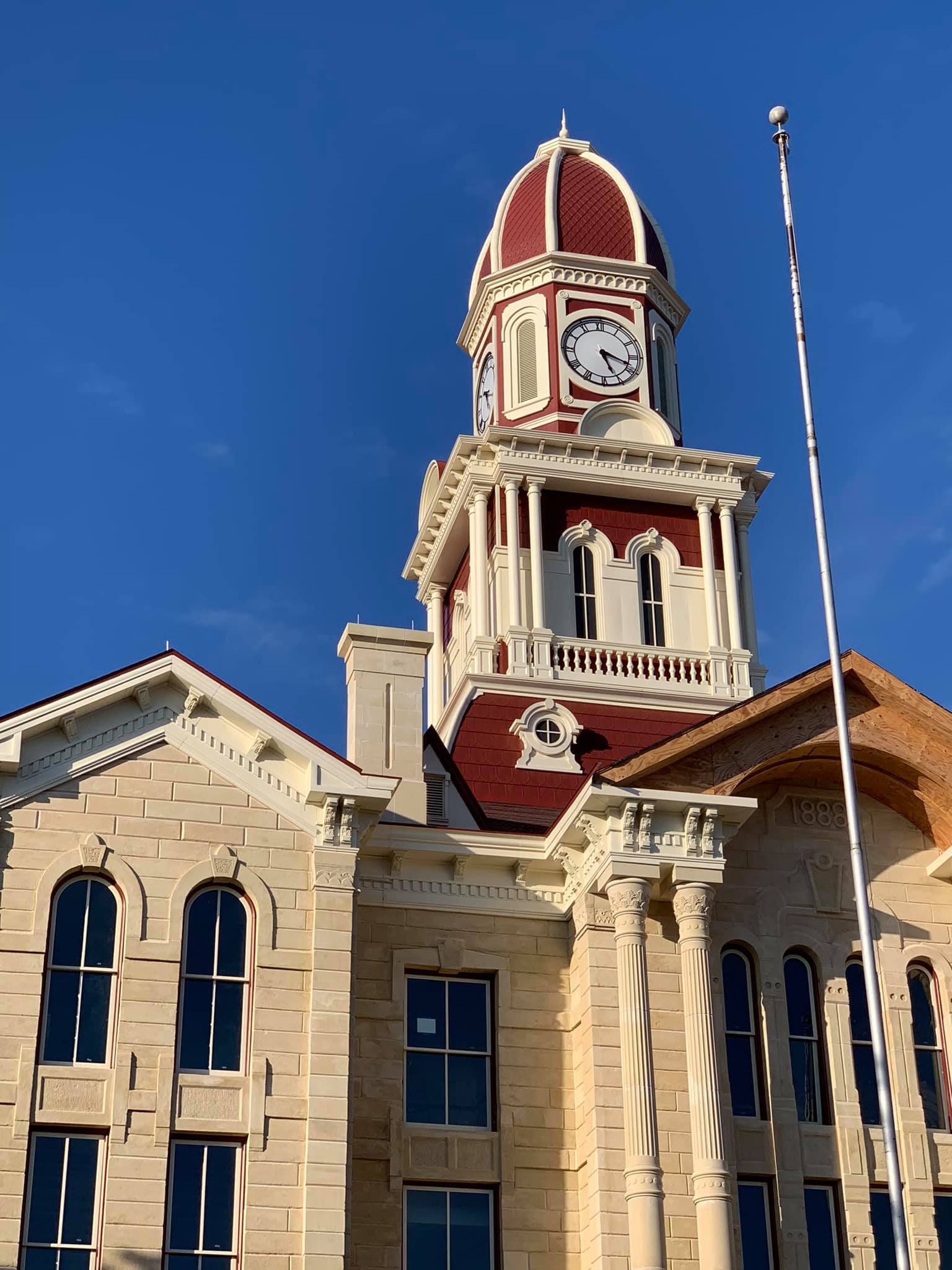 clock tower with reproduction of pressed historic shingles