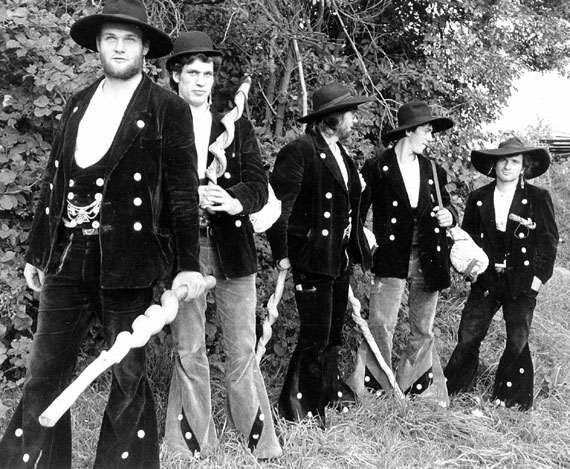 Historic black and white image of framers wearing their specific trades uniforms