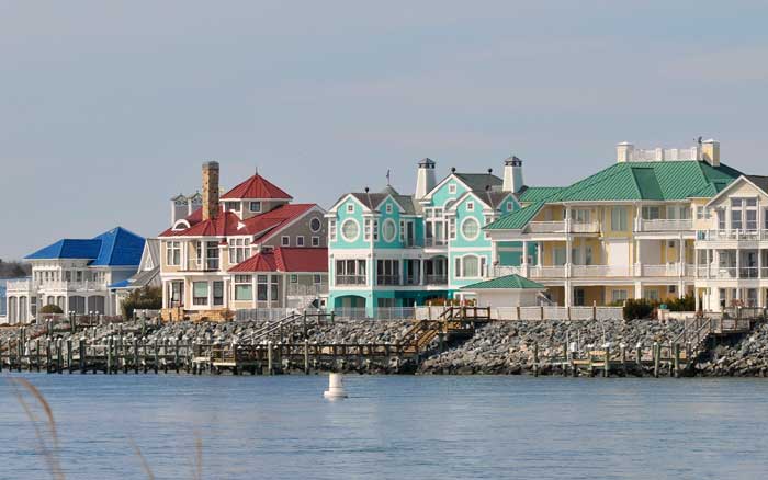 Buildings with colorful metal roofs on shore