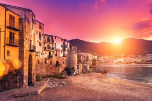 Colorful building on the beach at sunset
