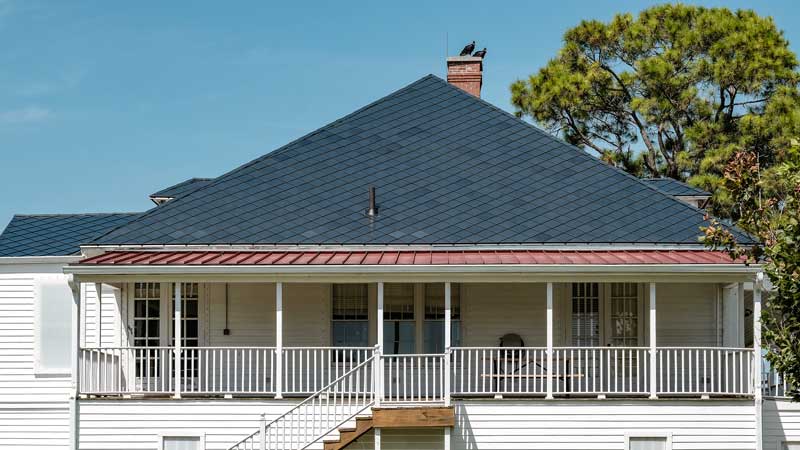 Home with Stainless stell custom colored shingles hail resistant