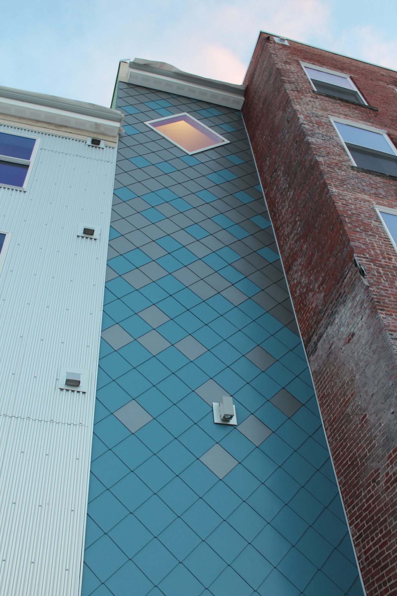Completed Spengler Industries metal diamond shingle roof installation with matching trims